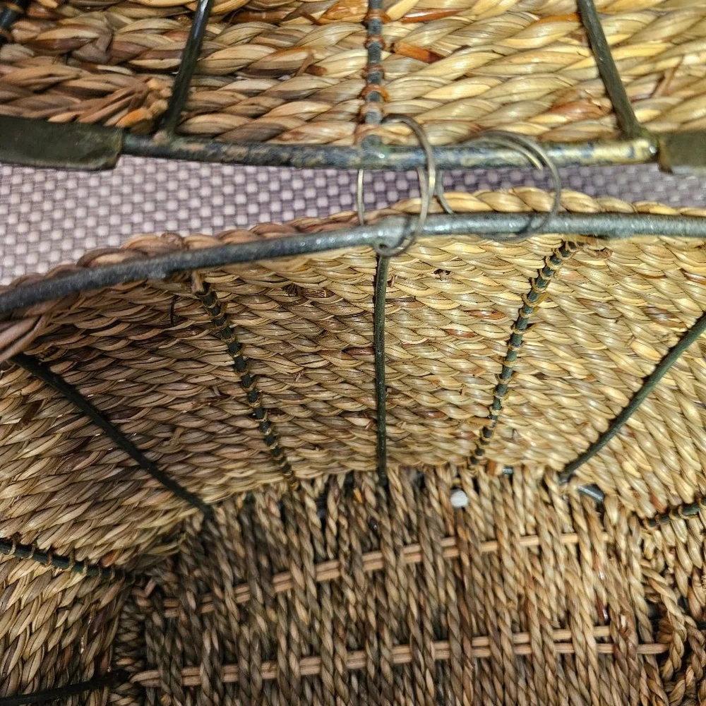 Vintage hand-woven coiled rye straw rattan wicker basket with metal leaf topper